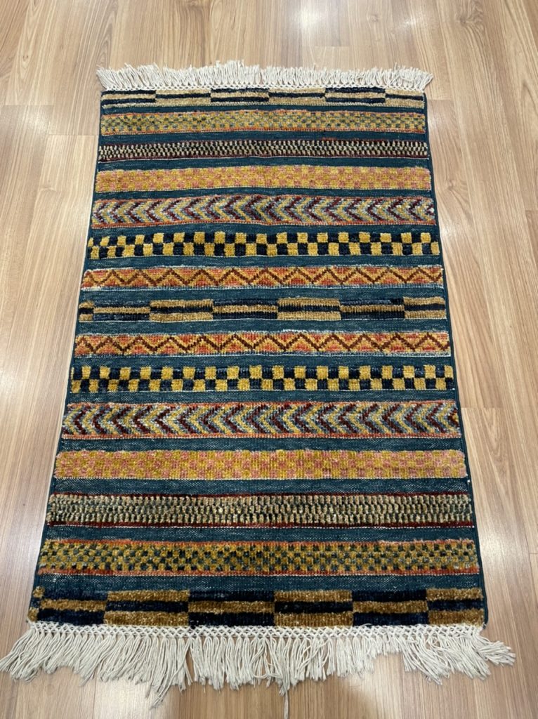 Small tribal wool rug 93 cm. X 60 cm.