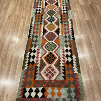 Bohemian handwoven wool kilim runner rug size 296 cm. X 87 cm.