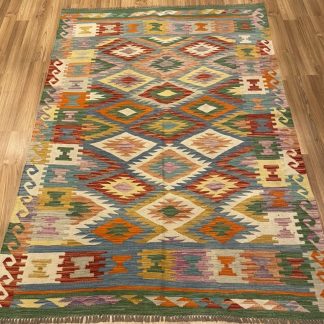 Bohemian handwoven wool kilim rug 210 cm. X 149 cm.